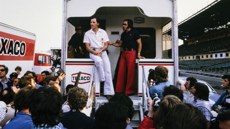 Graham Hill and Emerson Fittipaldi with media